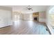 Open concept living room with stone fireplace, wood floors, and backyard access at 98 Pace Dr, Hiram, GA 30141
