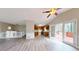 Open concept living room with wood floors, kitchen and backyard access at 98 Pace Dr, Hiram, GA 30141