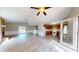 Open concept living room with stone fireplace, wood floors, kitchen and backyard access at 98 Pace Dr, Hiram, GA 30141