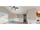 This living room features neutral paint, trim work, ceiling fan and beautiful wood-look laminate flooring at 98 Pace Dr, Hiram, GA 30141