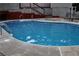 Sparkling pool featuring stainless steel ladders and a clean concrete surround at 98 Pace Dr, Hiram, GA 30141