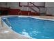 Backyard swimming pool with metal steps and concrete surroundings, great for outdoor fun and relaxation at 98 Pace Dr, Hiram, GA 30141