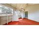 Enclosed screened porch with ample natural light and views, offering a tranquil spot to enjoy the outdoors at 98 Pace Dr, Hiram, GA 30141