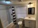 Clean bathroom with a shower, vanity, and toilet providing a functional and comfortable space at 1619 Flowery Branch Rd, Auburn, GA 30011