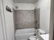 Modern bathroom with a tub, tiled shower, and contemporary fixtures for a fresh, updated look at 1619 Flowery Branch Rd, Auburn, GA 30011