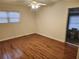 Spacious bedroom with wood floors, ceiling fan, and en suite bath access at 1619 Flowery Branch Rd, Auburn, GA 30011