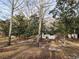 Quaint home surrounded by mature trees, offering a peaceful and private setting at 1619 Flowery Branch Rd, Auburn, GA 30011