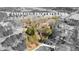 Aerial view showcasing the expansive property lines of the wooded lot with lake access at 260 Sandy Lake Cir, Fayetteville, GA 30214