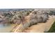 View shows a vast property including a lake, open fields, and wooded areas at 260 Sandy Lake Cir, Fayetteville, GA 30214
