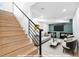 Bright basement features a staircase and is virtually staged as a living room at 260 Sandy Lake Cir, Fayetteville, GA 30214