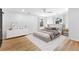 Bedroom is virtually staged with new flooring, furniture, and decor at 260 Sandy Lake Cir, Fayetteville, GA 30214