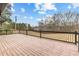 Overlooking lush greenery, this expansive deck provides scenic views at 260 Sandy Lake Cir, Fayetteville, GA 30214