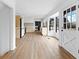 Open-concept living room with wood floors, modern lighting, and a view to the kitchen, providing ample space at 260 Sandy Lake Cir, Fayetteville, GA 30214