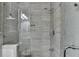 Updated bathroom with a glass shower and tiled walls at 3540 Paddocks Pkwy, Suwanee, GA 30024
