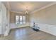 Dining room with hardwood floors, chandelier, and large windows at 3540 Paddocks Pkwy, Suwanee, GA 30024