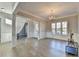 Spacious dining room with hardwood floors and chandelier at 3540 Paddocks Pkwy, Suwanee, GA 30024
