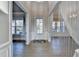Bright foyer with hardwood floors and view to another room at 3540 Paddocks Pkwy, Suwanee, GA 30024