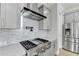 This gourmet kitchen features stainless appliances and plenty of countertop space at 3540 Paddocks Pkwy, Suwanee, GA 30024