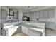 Gourmet kitchen featuring an island with seating and stainless steel appliances at 3540 Paddocks Pkwy, Suwanee, GA 30024