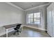 Home office with hardwood floors and natural light at 3540 Paddocks Pkwy, Suwanee, GA 30024