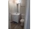 Bathroom features a modern vanity with sink, a mirror, and a standard toilet at 6104 Cobblestone Ct, Douglasville, GA 30134
