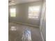 This is a bedroom with two windows allowing natural light to illuminate the carpeted floor at 6104 Cobblestone Ct, Douglasville, GA 30134