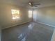 This is a bedroom with two windows allowing natural light to illuminate the carpeted floor at 6104 Cobblestone Ct, Douglasville, GA 30134