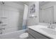 Clean bathroom featuring a shower-tub combo with a white curtain and a white vanity at 921 Ambient Sw Way, Atlanta, GA 30331