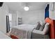 Bedroom with plush carpet, colorful accents, and access to a staircase at 921 Ambient Sw Way, Atlanta, GA 30331