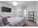 Bedroom featuring plush carpet, modern dresser, and ample natural light at 921 Ambient Sw Way, Atlanta, GA 30331