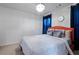 Bedroom with plush carpet, modern light fixture, and neutral gray color scheme at 921 Ambient Sw Way, Atlanta, GA 30331