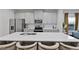 Well-equipped kitchen featuring a large island with seating and stainless steel appliances at 921 Ambient Sw Way, Atlanta, GA 30331