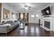 Spacious living room featuring hardwood floors, a fireplace, and a comfortable seating area at 921 Ambient Sw Way, Atlanta, GA 30331