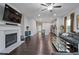 Inviting living room with a fireplace, hardwood floors, an open layout, and modern decor at 921 Ambient Sw Way, Atlanta, GA 30331