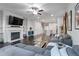 Cozy living room with a fireplace, hardwood floors, an open layout, and modern decor at 921 Ambient Sw Way, Atlanta, GA 30331