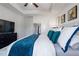 Bright main bedroom features a modern color scheme, tray ceiling, and plenty of natural light at 921 Ambient Sw Way, Atlanta, GA 30331
