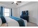 Bright main bedroom with plush carpet, ceiling fan, and a modern color scheme at 921 Ambient Sw Way, Atlanta, GA 30331