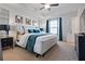 Primary bedroom with tray ceiling, neutral carpet, and a padded headboard at 921 Ambient Sw Way, Atlanta, GA 30331