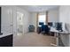 Bright office space with three monitors, plush blue chair, and lots of natural light at 921 Ambient Sw Way, Atlanta, GA 30331