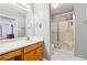 Bathroom with a tiled shower, and a vanity with storage space below the counter top at 135 Wilbanks Dr, Fayetteville, GA 30215