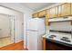Functional kitchen includes stove, refrigerator and overhead cabinets at 135 Wilbanks Dr, Fayetteville, GA 30215