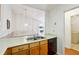 Cozy eat-in kitchen featuring stainless steel sink and dishwasher at 135 Wilbanks Dr, Fayetteville, GA 30215