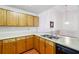 Kitchen with wood cabinets, white countertop and stainless sink at 135 Wilbanks Dr, Fayetteville, GA 30215