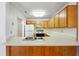 Compact kitchen featuring a stainless steel sink and ample counter space at 135 Wilbanks Dr, Fayetteville, GA 30215