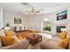 Staged living room features a fireplace, wood floors, and neutral furnishings at 135 Wilbanks Dr, Fayetteville, GA 30215