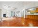 Open concept living room with hardwood floors flows into the adjacent kitchen at 135 Wilbanks Dr, Fayetteville, GA 30215