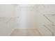 Spacious walk-in closet with wire shelving for organized storage and neutral carpet at 135 Wilbanks Dr, Fayetteville, GA 30215