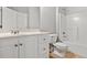 Bathroom featuring a single sink, a tiled shower/tub, and tile floors for a clean design at 1859 Mapmaker Dr, Dacula, GA 30019