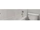 Clean bathroom with tub and toilet at 1859 Mapmaker Dr, Dacula, GA 30019