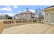 Wooden backyard deck with fencing on one side and access to the home on the other at 1859 Mapmaker Dr, Dacula, GA 30019